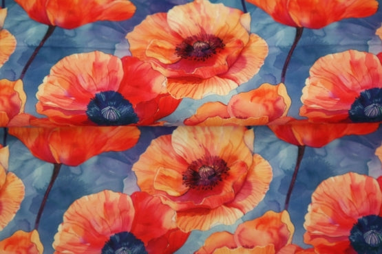 Popeline de viscose - Champs de coquelicots sur fond bleu (Prix pour 10cm)