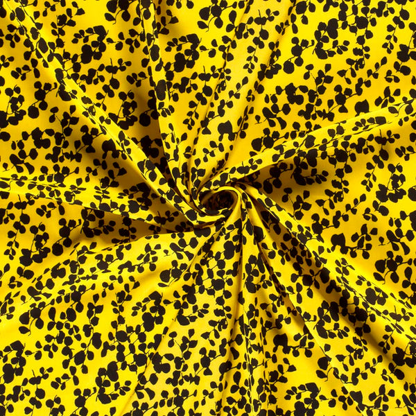 Super popeline de bambou "feuillage noir sur fond jaune" (prix pour 10cm)