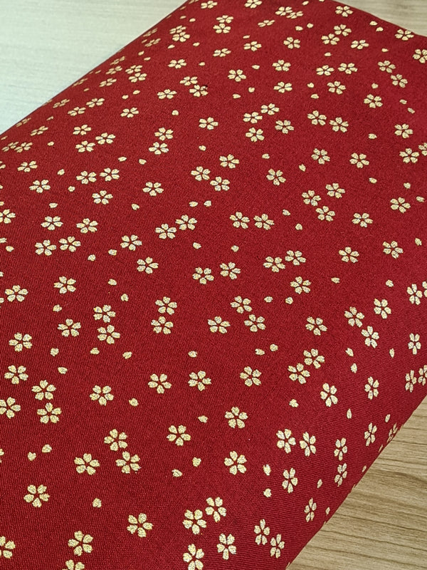 Tissu Fleurs de cerisiers dorées sur fond rouge (prix pour 10cm)